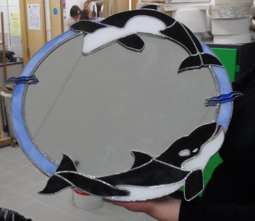 Mirror decorated with killer whales